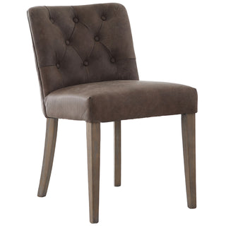 Stanton leather dining chair close-up showing button-tufted back in distressed brown Italian top leather