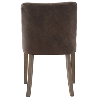 Stanton dining chair rear detail showing piped edging and weathered oak legs