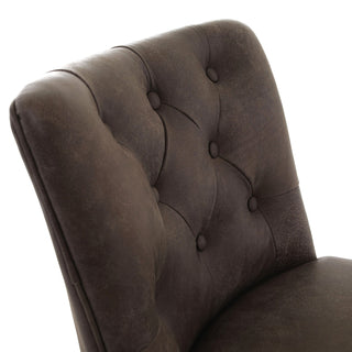 Close-up of a dark brown tufted upholstered chair back with button tufting and a distressed leather-like texture, shown against a white background.