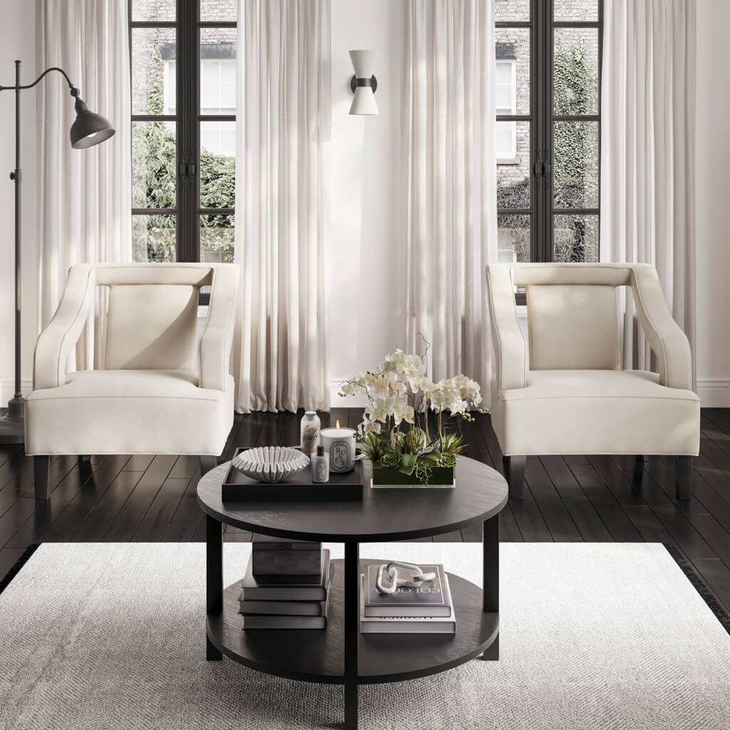 The Studio CTH Beatrice Upholstered Occasional Chair in Ivory exudes sophistication with its elegant contrast piping and refined silhouette. Its plush seat offers luxurious comfort, while the sleek matte black legs add a modern touch. Ideal for any contemporary living space.