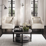 The Studio CTH Beatrice Upholstered Occasional Chair in Ivory exudes sophistication with its elegant contrast piping and refined silhouette. Its plush seat offers luxurious comfort, while the sleek matte black legs add a modern touch. Ideal for any contemporary living space.