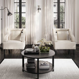 The Studio CTH Beatrice Upholstered Occasional Chair in Ivory exudes sophistication with its elegant contrast piping and refined silhouette. Its plush seat offers luxurious comfort, while the sleek matte black legs add a modern touch. Ideal for any contemporary living space.