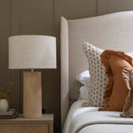  Neutral bedroom styling with Terra Fibre glass Lamp and layered cushions