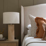  Neutral bedroom styling with Terra Fibre glass Lamp and layered cushions