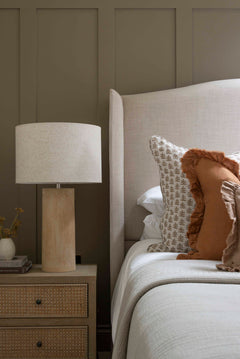  Neutral bedroom styling with Terra Fibre glass Lamp and layered cushions