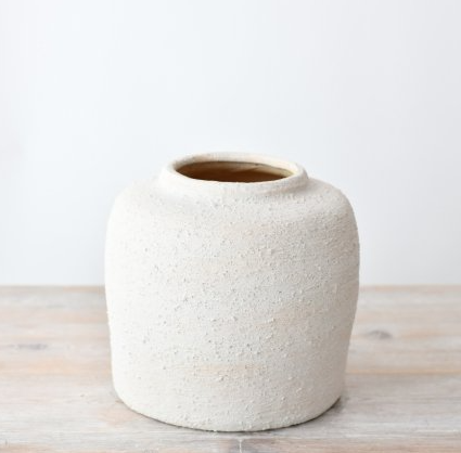Textured ceramic vase with natural finish