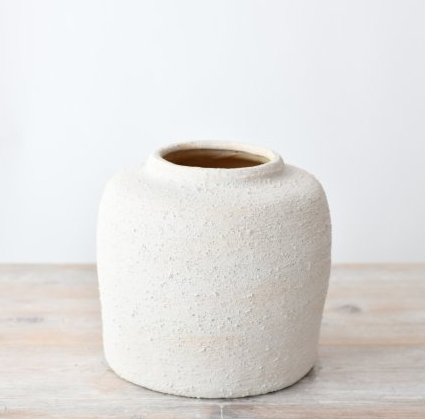 Textured ceramic vase with natural finish