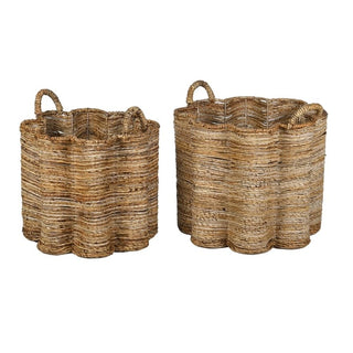 Two natural woven seagrass storage baskets with scalloped edges and loop handles, shown on a plain white background.