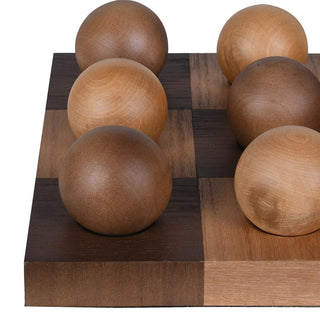 Close-up of the light and dark wooden playing spheres on a chequered board