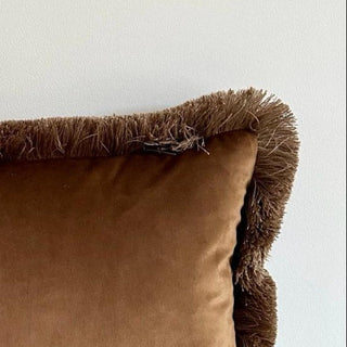 Close up of the Naunton chestnut velvet and fringed edge