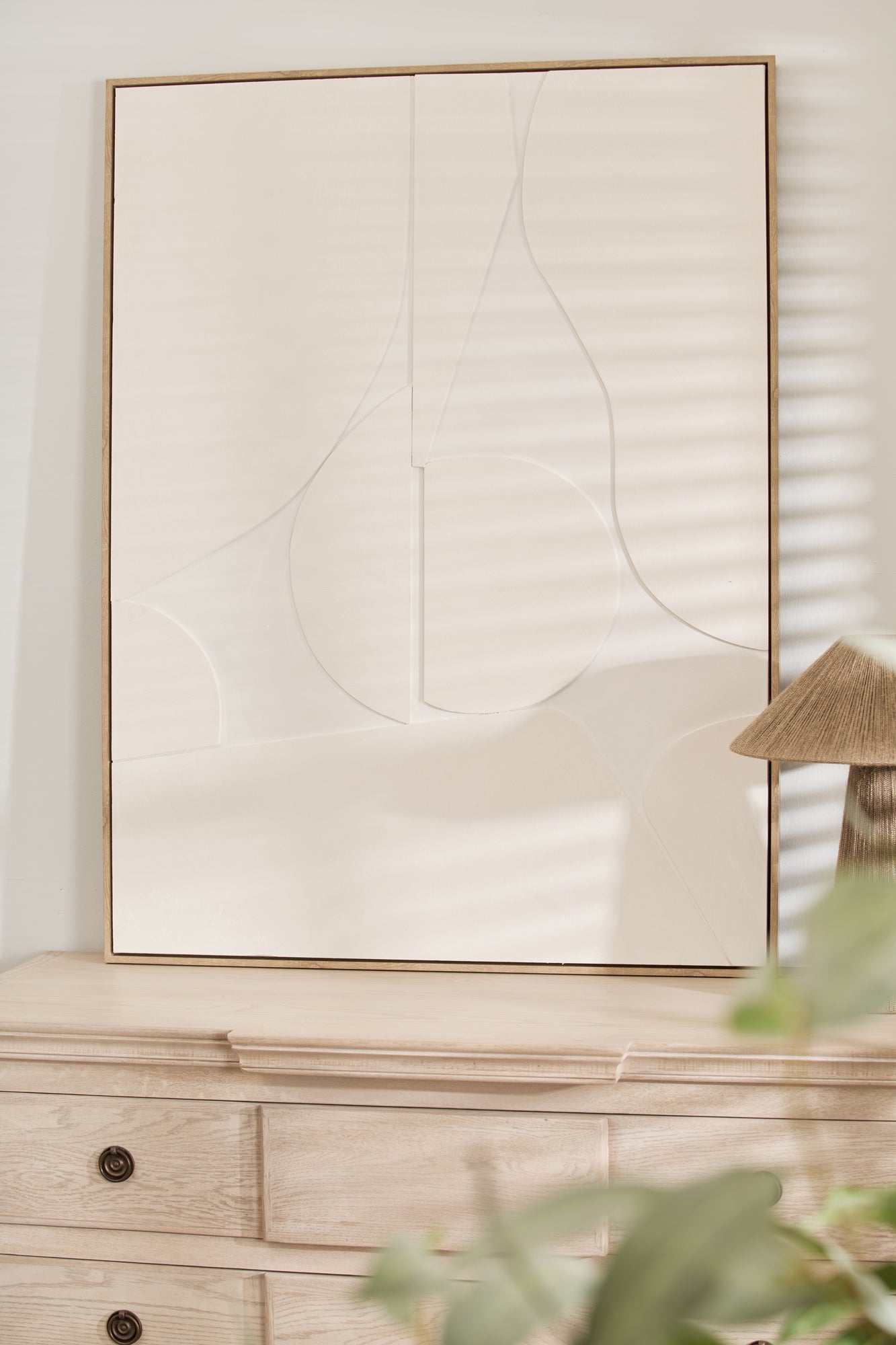 Minimalist white textured wall art with abstract geometric shapes