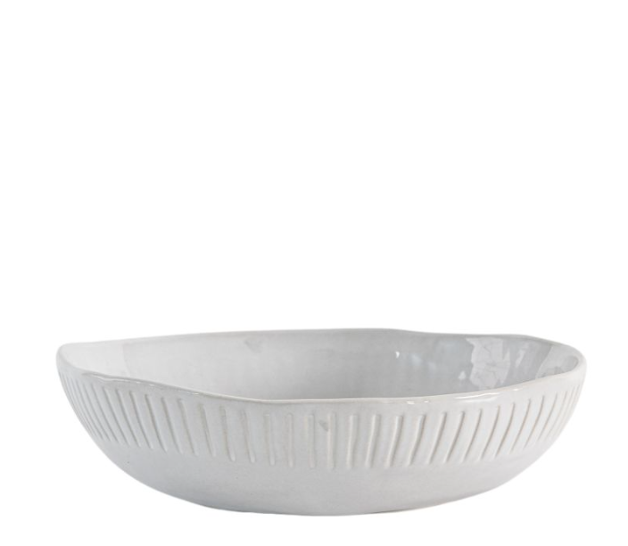 White ceramic bowl with textured design on a white background