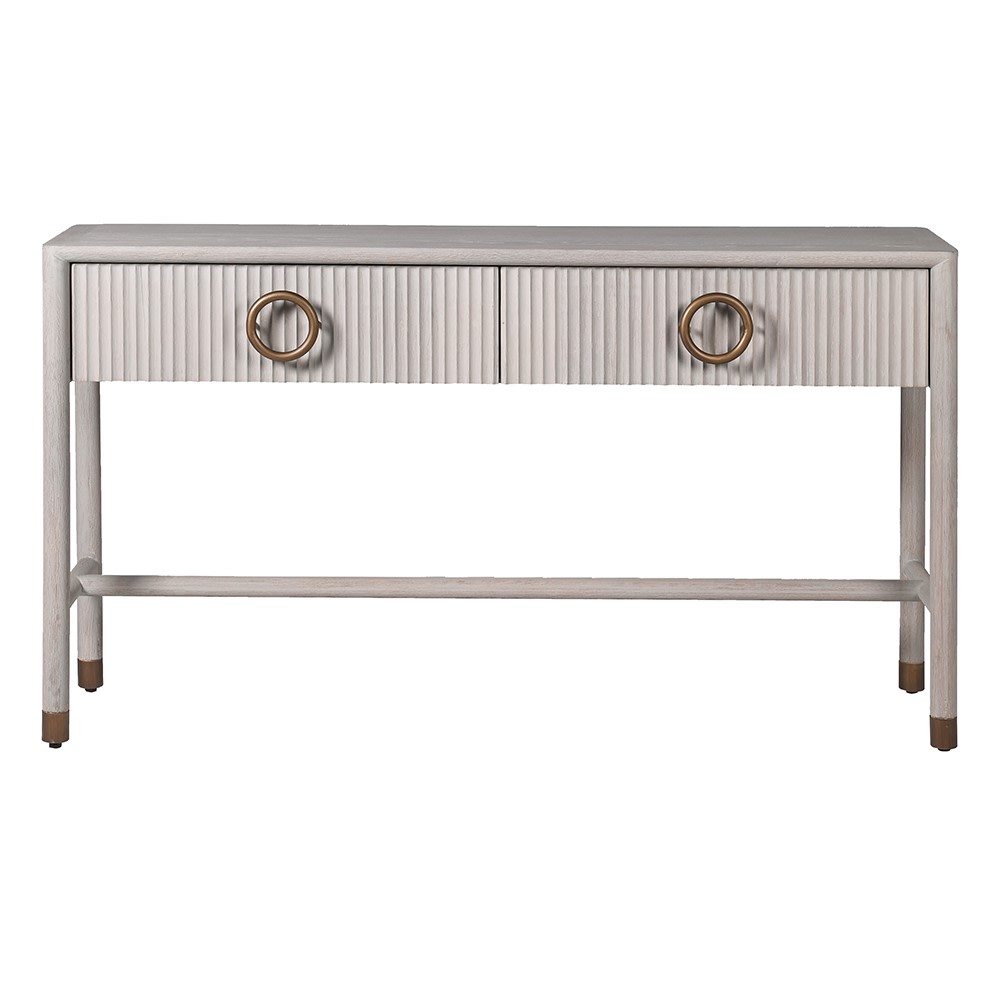 The Zahara white oak console table features two drawers and is crafted from premium oak and oak veneer and finished in an off white with a fluted detail.

Complete with a gorgeous round handle finished in bronze