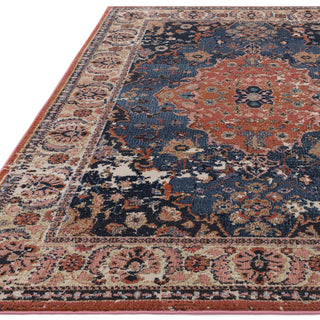 Close-up of the Zola Heris rug pattern in blue and rust