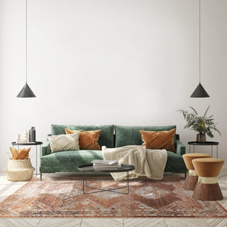 Zola Tark traditional rug in turquoise multicolour styled in a living room