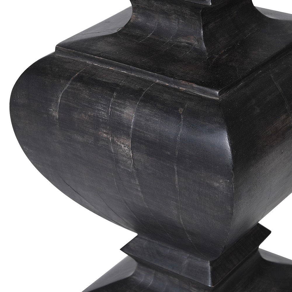 The balustrade-shaped lamp base is hand-carved from mango wood.