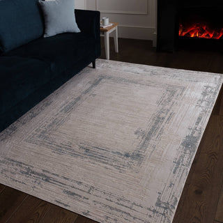 Anders bordered rug in ivory and powder blue styled in a living room