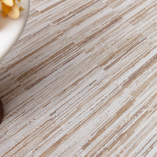 Close-up of the Anders striped rug in ivory and golden sand showing the space-dyed pile