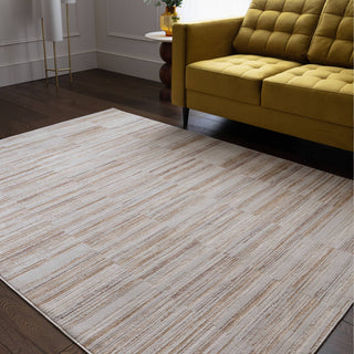 Anders striped rug in ivory and golden sand styled in a living room