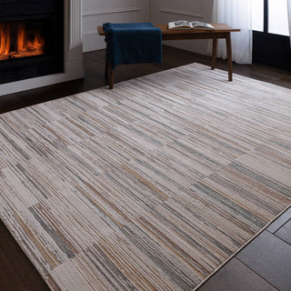 Anders striped rug in grey, taupe and blue styled in a living room