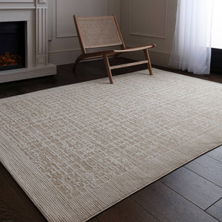 Anders grid rug in beige and stone styled in a living room