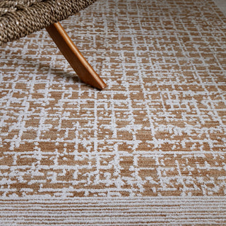 Close-up of the Anders grid rug in warm tan and mocha showing the space-dyed pile