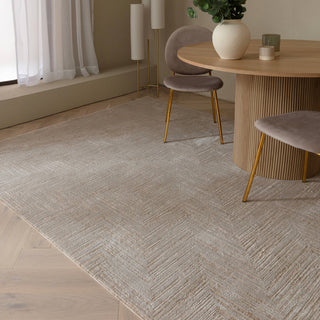 Anders chevron rug in cream and warm beige styled in a living room