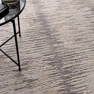 Close-up of the Anders brushstroke rug in light grey and charcoal showing the space-dyed pile