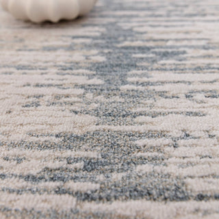 Close-up of the Anders brushstroke rug in ivory and steel blue showing the space-dyed pile