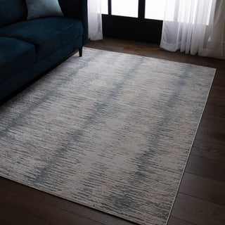 Anders brushstroke rug in ivory and steel blue styled in a living room