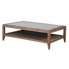 bayur wood coffee table with glass top and rattan shelf - angled view"