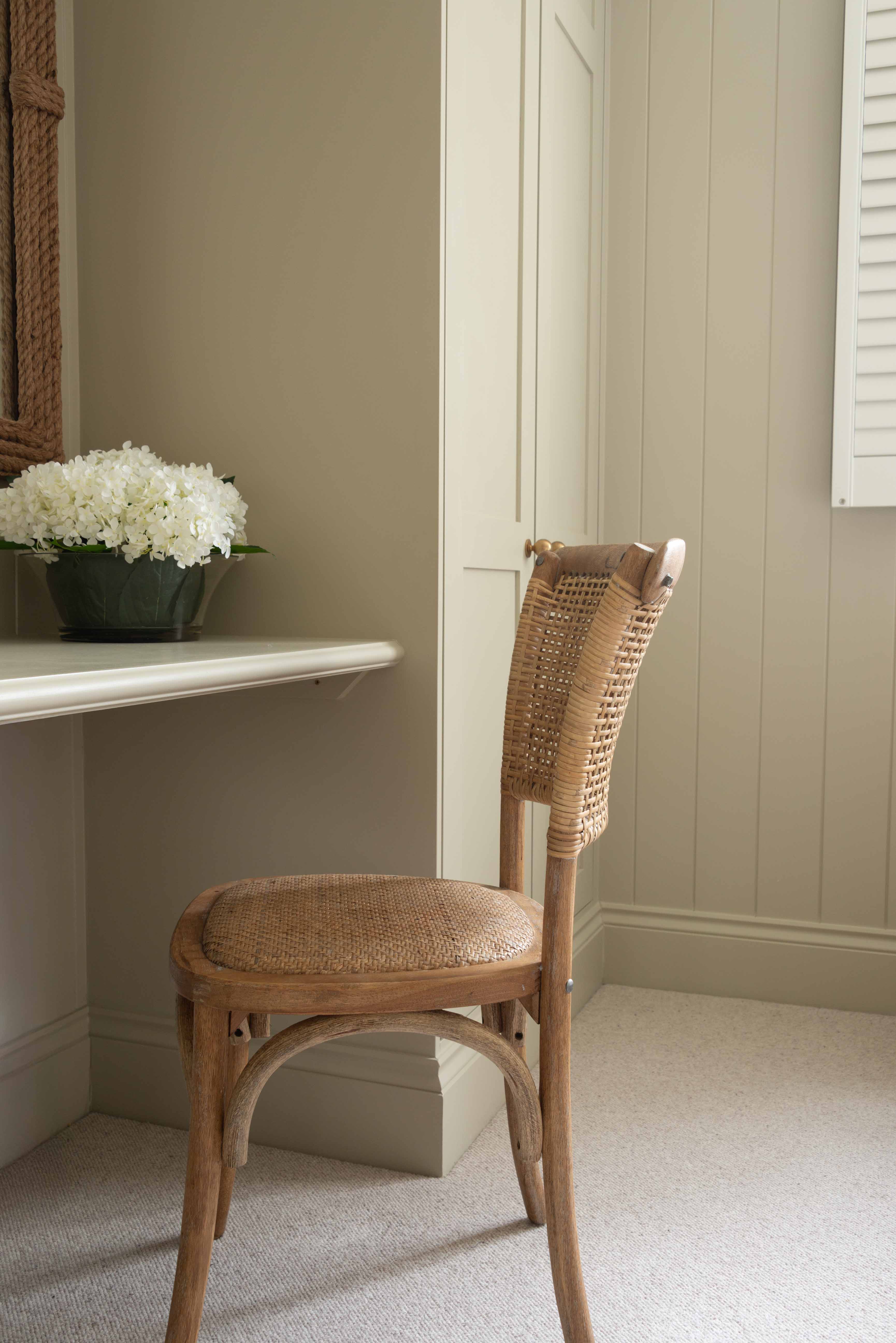 Exuding French-inspired elegance, this stunning open weave back chair is expertly crafted from premium rubber wood and rustic rattan.