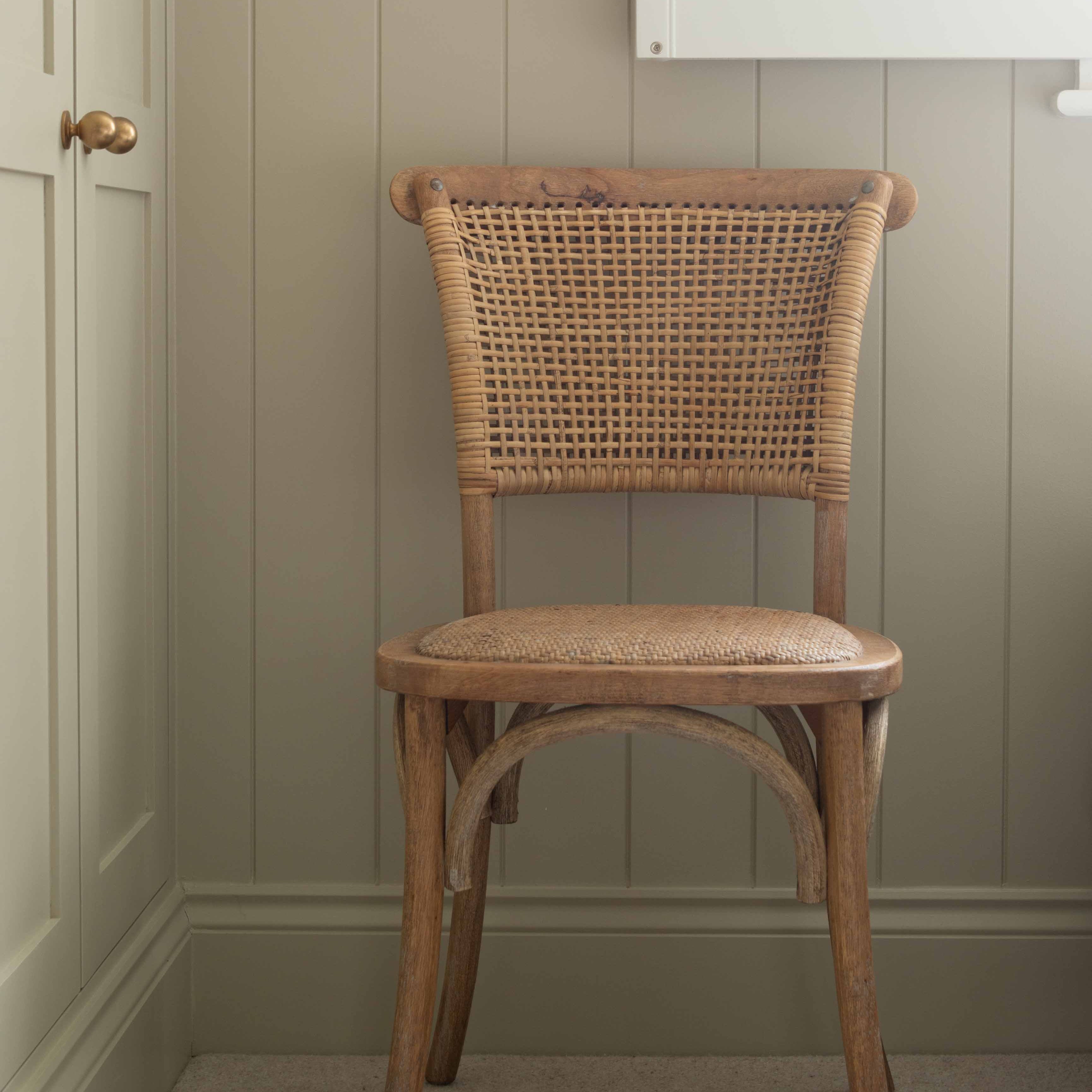 Exuding French-inspired elegance, this stunning open weave back chair is expertly crafted from premium rubber wood and rustic rattan.