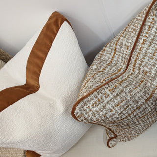 Elkstone cushion trio styled on a sofa