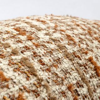 Velvet band detail on the bouclé cushion