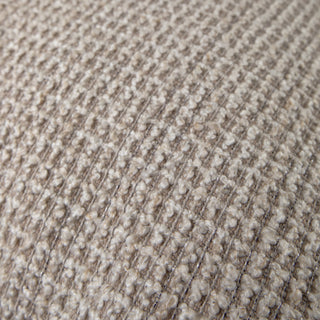 Frampton stone cushion styled on a sofa