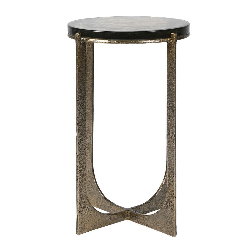 Small round table with glass top and metallic gold base on a white background