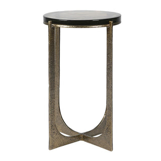 Small round table with glass top and metallic gold base on a white background