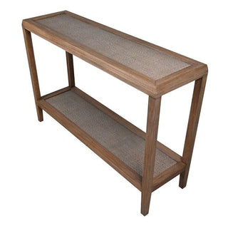 Bali Grove slim console table side view showing bayur wood frame, tapered legs and woven rattan shelf detail