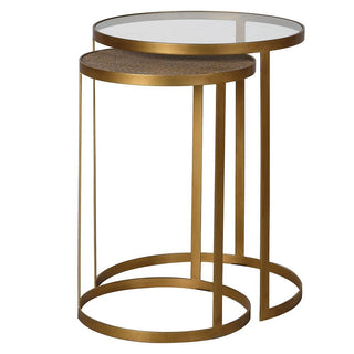 Set of two gold side tables with glass tops on a white background