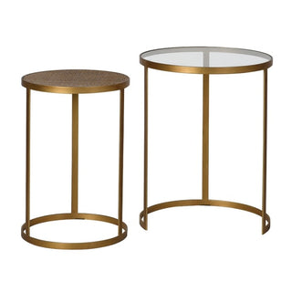 Two gold side tables with glass tops on a white background