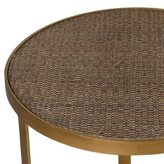 Round woven table with a textured surface on a white background