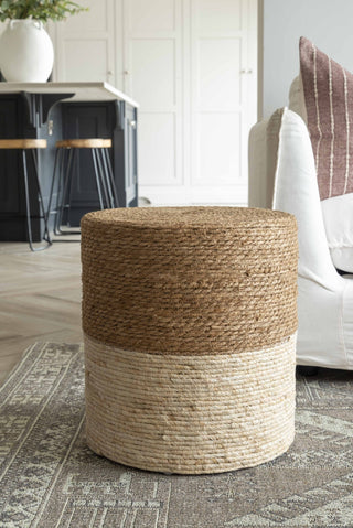 Woven storage ottoman in a living room setting