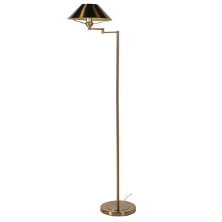 Brass floor lamp with shade on a white background