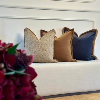 Sherston ochre flecked cushion in a living room