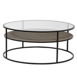 Round coffee table with metal frame, glass top and rattan shelf