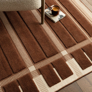 Close-up of the raised wool blocks on the Fable rug in chocolate