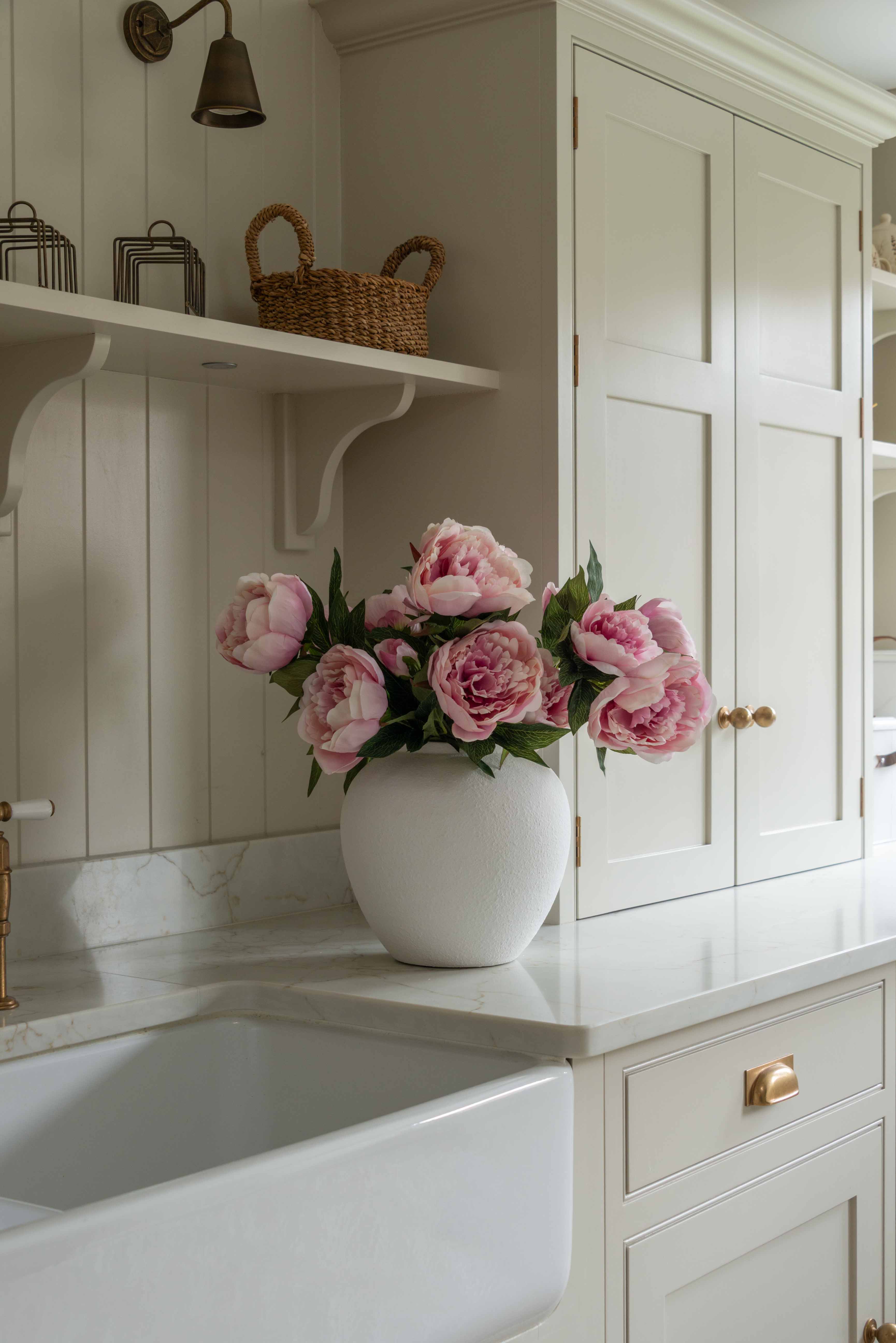 lifelike, real-touch Peony stems in a delicate shade of blush pink. Each stem boasts two fully open blooms full of petals, along with a budding side shoot and gorgeous green foliage.

Each petal is meticulously hand-crafted and hand-painted.&nbsp;