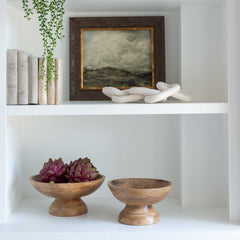 A set of three decorative faux green and purple artichokes.