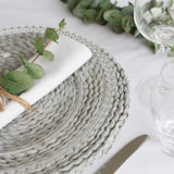 Made from moulded glass these plates feature on their outer edge lovely small glass beads. 